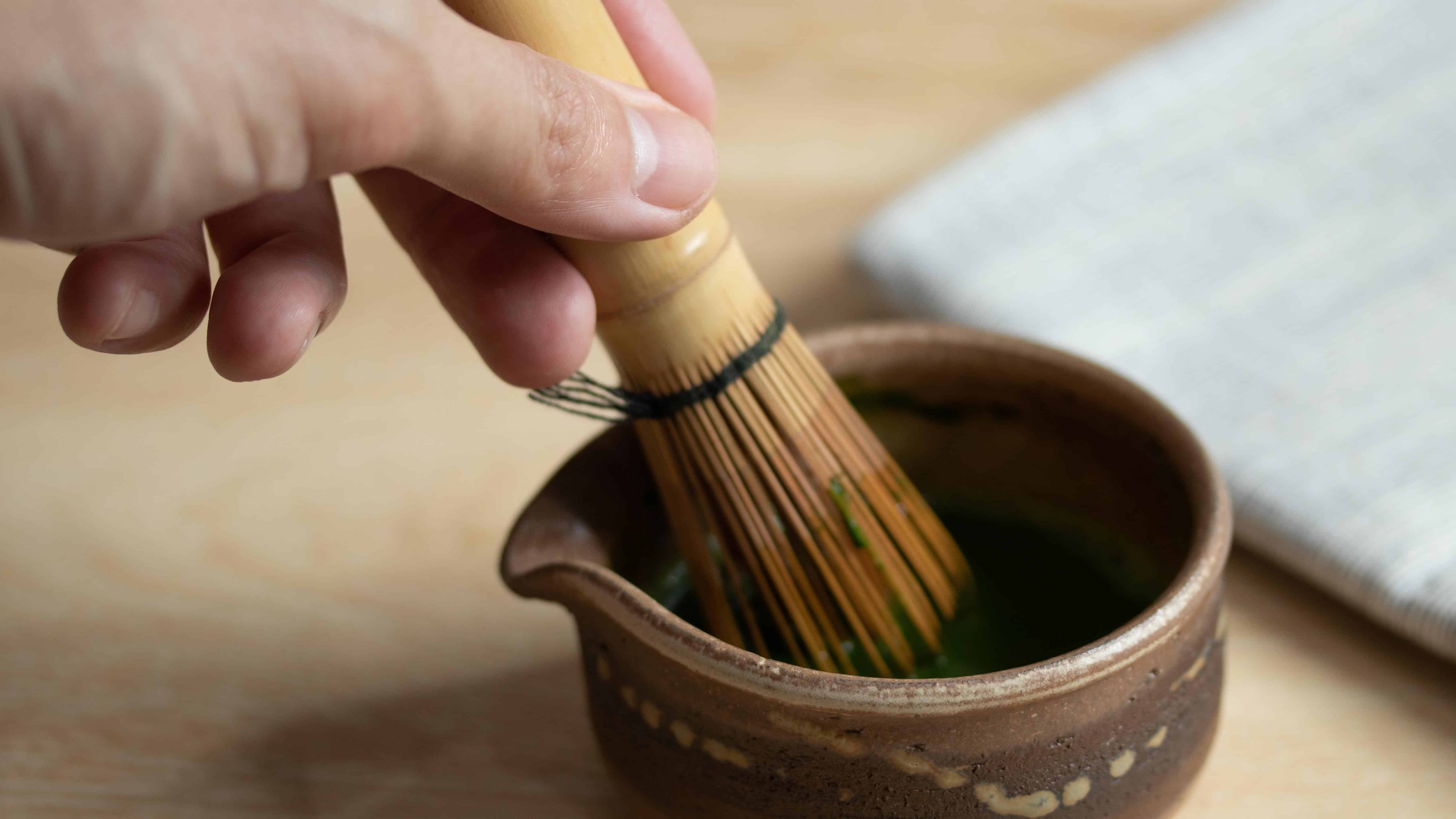 mixing matcha with whisk